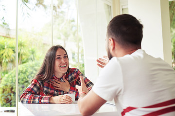 Wall Mural -  Man and woman in bright room are vigorously discussing somethin