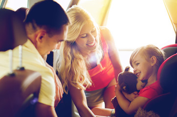 Sticker - happy parents with little girl in baby car seat