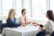 © Syda Productions - happy women drinking champagne at restaurant