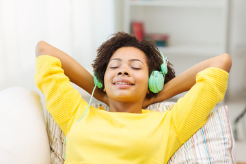 Wall Mural - happy woman with headphones listening to music