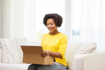 Sticker - happy african young woman with parcel box at home