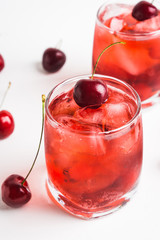 Wall Mural - Red cocktail with cherry on the wooden background