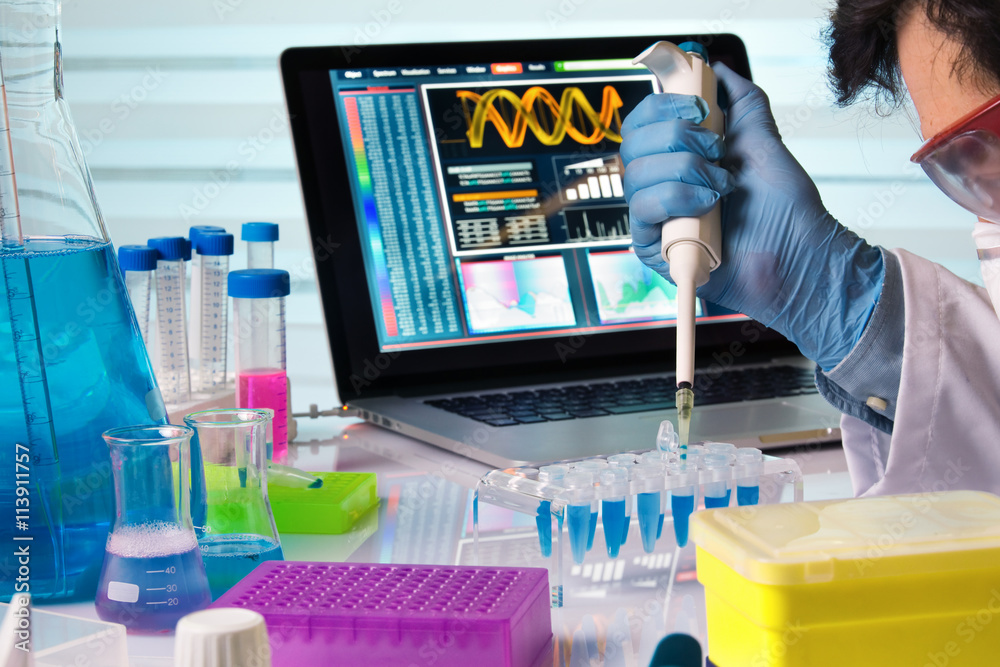 engineer genetic working in laboratory with pipette /scientist holding ...