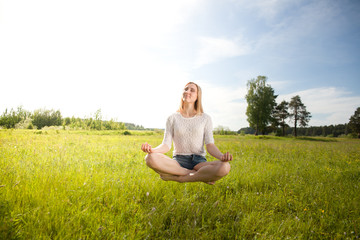 girl meditating and levitating (collage)