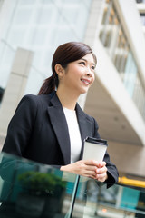 Wall Mural - Business woman hold with coffee cup