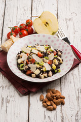 Canvas Print - black rice salad with tomatoes apple almond and parmesan cheese