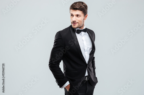 Valokuvatapetti Attractive young man in tuxedo and bowtie