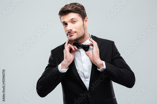 Valokuva  Portrait of handsome young man in tuxedo with bowtie