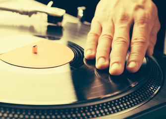 turntable scratch, hand of dj on the vinyl record