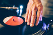 © nikkytok - turntable scratch, hand of dj on the vinyl record