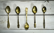 Old Spoons On A White Wooden Background. Top View