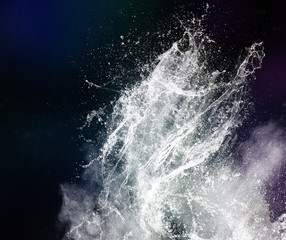 Poster - Water splash and powder on black background