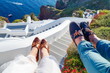 © creativefamily - Couples legs enjoying summer day at Santorini island