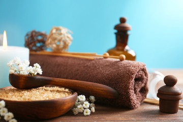 Poster - Spa treatments on wooden table against blue background