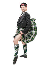 Scottish Man In Traditional National Costume With Blowing Kilt