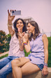 © chika_milan - Two Girls making selfie, Outdoors, leisure concept