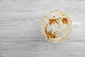 Canvas Print - Cup of fresh coffee on wooden background