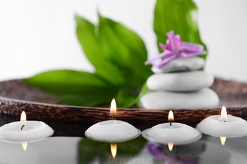 Poster - Spa composition with candles on light background