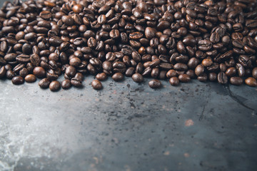 Coffee beans on rustic metal grey background