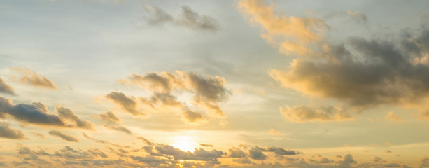 Wall Mural - sunset behind the cloud and orange sky