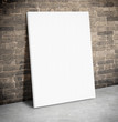 Blank white paper poster on the grunge brick wall and cement flo