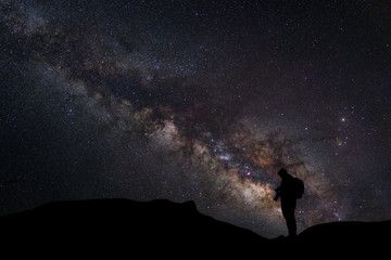 Wall Mural - landscape with milky way, night sky with stars and silhouette of