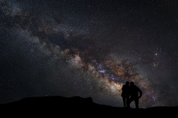 Wall Mural - landscape with milky way, night sky with stars and silhouette of
