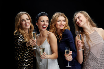 Sticker - happy women with champagne glasses over black