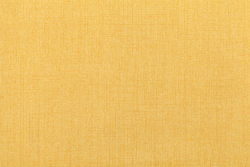 Sticker - Light yellow ocher background from a textile material. Fabric with natural texture. Backdrop.