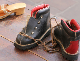 old shoes in dark leather in the flea market on the street