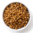 White ceramic bowl of brown cooked lentils isolated on white fro