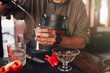 © Jacob Lund - Barman preparing exotic cocktail