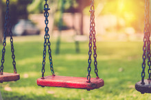 Empty Chain Swing In Children Playgriund. Vintage Filter