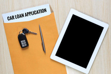 Wall Mural - Top view of car loan application in envelope with car remote key