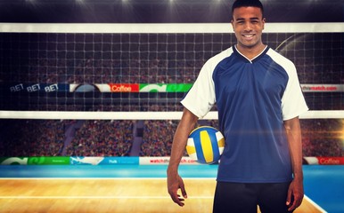 Canvas Print - Composite image of sportsman holding a volleyball