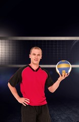 Canvas Print - Composite image of sportsman holding a volleyball