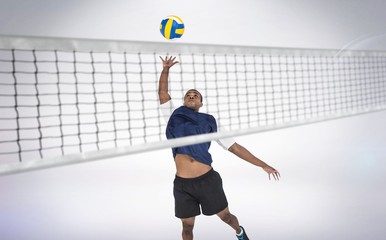 Wall Mural - Composite image of sportsman playing volleyball