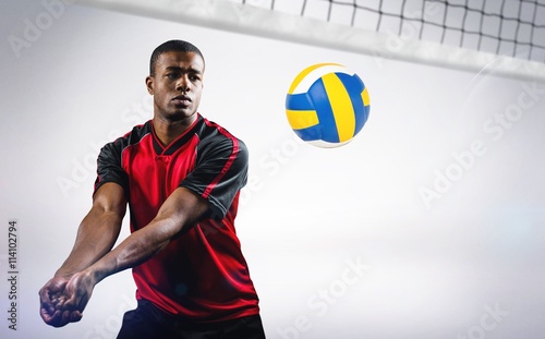 Fotomural Composite image of sportsman playing volleyball