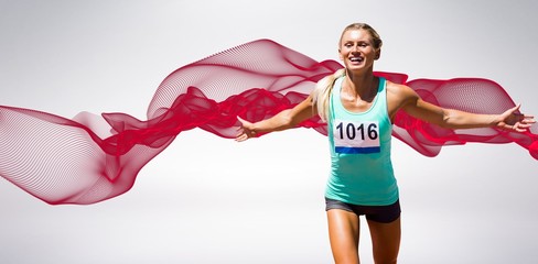 Wall Mural - Composite image of sportswoman finishing her run