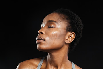 Close-up portrait of african woman with eyes closed