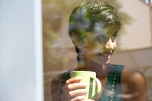 Woman Holding Mug Of Coffee