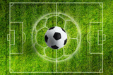 Fototapeta Sport - Soccer ball on green grass stadium with white layout