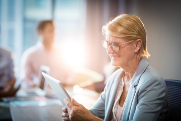 Poster - Businesswoman using digital tablet