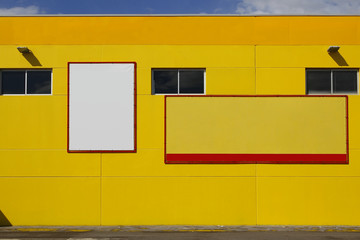 Wall Mural - Blank billboard in a yellow wall