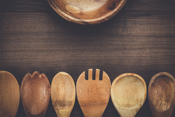 Wall Mural - different wooden spoons and bowl on the blue table