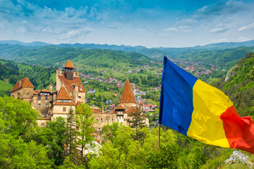 Wall Mural - Panoramic view over the medieval architecture of famous Bran castle and the surroundings - Romania