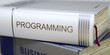 © tashatuvango - Stack of Books with Title - Programming. Closeup View. Programming - Leatherbound Book in the Stack. Closeup. Book Title on the Spine - Programming. Closeup View. Stack of Books. Blurred 3D Rendering.