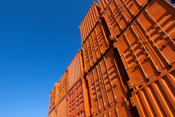 Wall Mural - Stacks of orange shipping containers