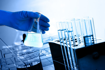 Laboratory glassware containing chemical liquid, science researc