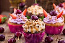 Delicious Cupcakes Decorated With Caramel And Fresh Berries